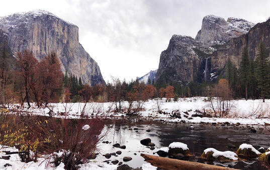 A snowy landscape in Yosemite National Park in winter.