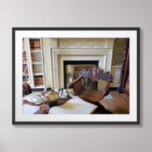 Photograph of an 18th-century study at White Hall Mansion in Richmond, Kentucky, featuring ornate furniture, a vintage fireplace, and historical charm.