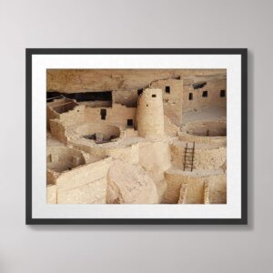 A detailed closeup photograph of Cliff Palace, highlighting the intricate stonework, round tower, and ceremonial kivas of the Ancestral Puebloan cliff dwelling in Mesa Verde National Park, Colorado.