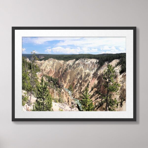 Grand Canyon of the Yellowstone at Yellowstone National Park with vibrant cliffs, lush surroundings, and a serene view of the canyon.