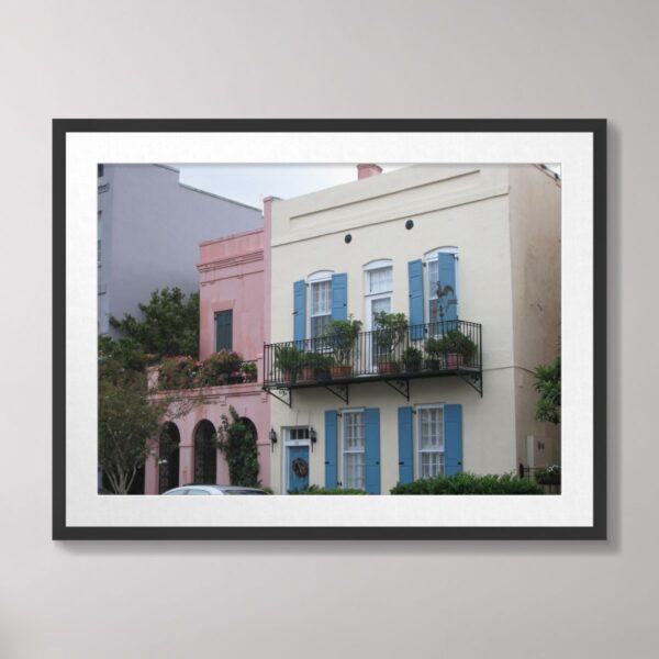 Photograph of colorful Rainbow Row houses in Charleston, South Carolina, featuring pastel hues, decorative shutters, and lush greenery.