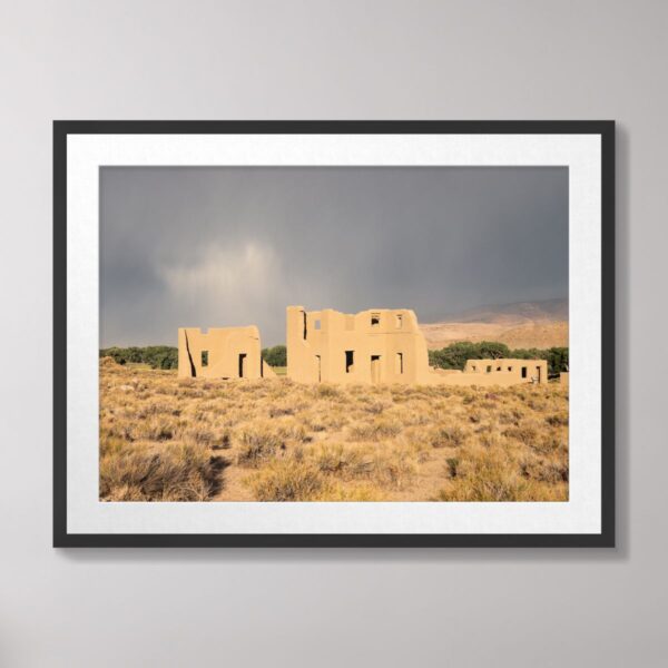 Fort Churchill's adobe ruins in Silver Springs, Nevada, set against a backdrop of storm clouds and golden desert grasses, creating a dramatic and historic scene.