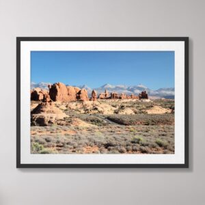 The Windows at Arches National Park wall art print featuring stunning red rock formations against a clear blue sky in Moab, Utah.