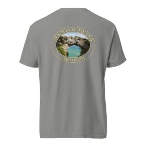 Grey Comfort Colors 1717 heavyweight T-shirt featuring Arch Rock on Mackinac Island, Michigan, with a scenic lake view framed by natural rock formations in an oval design.