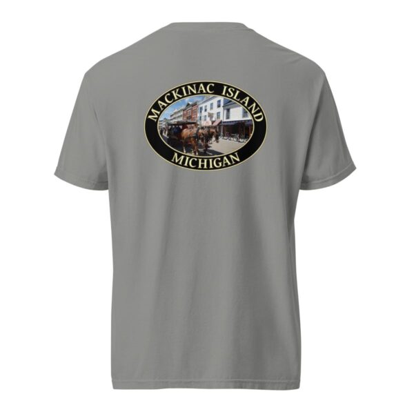 Grey Comfort Colors 1717 heavyweight T-shirt featuring downtown Mackinac Island horse and carriage graphic with historic buildings in an oval design.