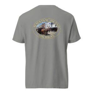 Grey Comfort Colors 1717 heavyweight T-shirt featuring downtown Mackinac Island horse and carriage graphic with historic buildings in an oval design.