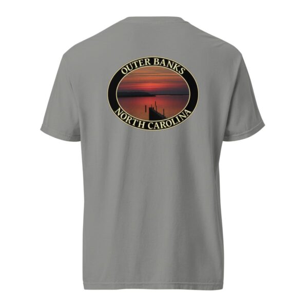 Grey Comfort Colors 1717 heavyweight T-shirt featuring Albemarle Sound sunset graphic on the Outer Banks, with a silhouetted pier and vibrant red sky in an oval design.