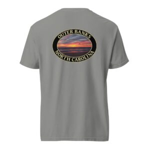 Grey Comfort Colors 1717 heavyweight T-shirt featuring a vibrant Kitty Hawk sunrise graphic in Outer Banks, North Carolina, with colorful clouds over the ocean horizon in an oval design.