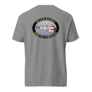 Grey Comfort Colors 1717 heavyweight T-shirt featuring a fishing boats graphic at Oregon Inlet, Outer Banks, North Carolina, with calm water reflections and a clear sky in an oval design.