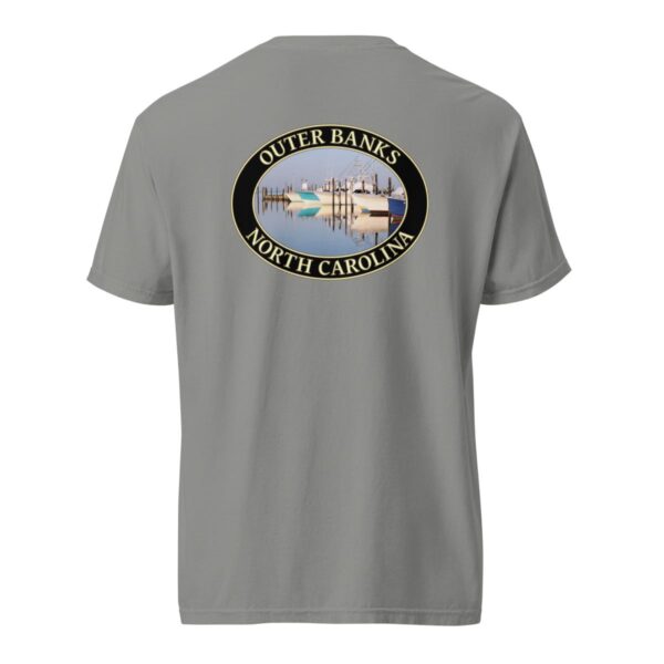 Grey Comfort Colors 1717 heavyweight T-shirt featuring a fishing boats graphic at Oregon Inlet, Outer Banks, North Carolina, with calm water reflections and a clear sky in an oval design.