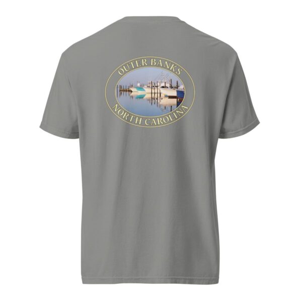 Grey Comfort Colors 1717 heavyweight T-shirt featuring a fishing boats graphic at Oregon Inlet, Outer Banks, North Carolina, with calm water reflections and a clear sky in an oval design.