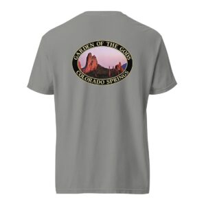 Grey Comfort Colors 1717 heavyweight T-shirt featuring a Sunset at Garden of the Gods in Colorado Springs graphic with red rock formations and a pink sky in an oval design.