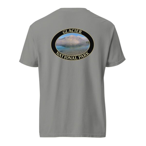 Grey Comfort Colors 1717 heavyweight T-shirt featuring Lake McDonald at Glacier National Park graphic with mountains and water reflection in an oval design.