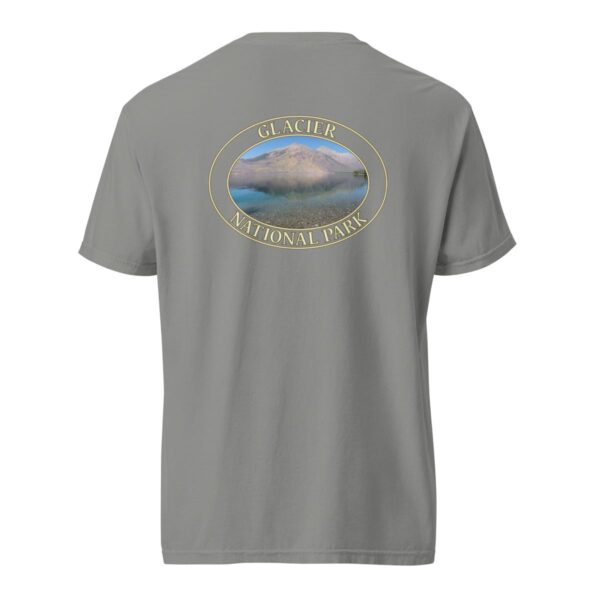 Grey Comfort Colors 1717 heavyweight T-shirt featuring Lake McDonald at Glacier National Park graphic with mountains and water reflection in an oval design.