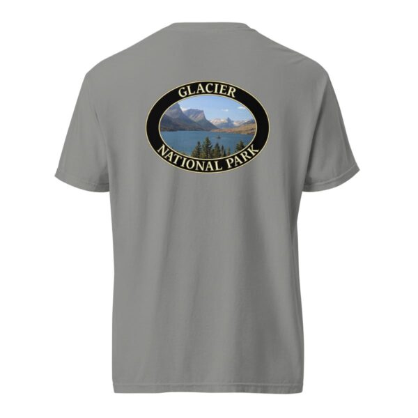 Grey Comfort Colors 1717 heavyweight T-shirt featuring Saint Mary Lake at Glacier National Park graphic with mountain peaks, evergreen trees, and blue waters in an oval design.