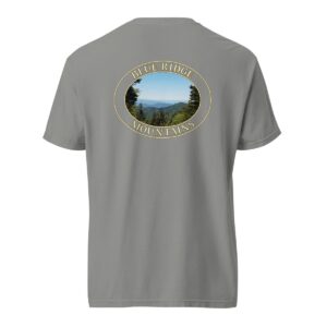 Grey Comfort Colors 1717 heavyweight T-shirt featuring a scenic view of the Blue Ridge Mountains in North Carolina with lush greenery and distant rolling peaks in an oval design.