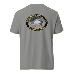 Grey Comfort Colors 1717 heavyweight T-shirt featuring a graphic of wild horses grazing in Theodore Roosevelt National Park’s grasslands, in an oval design.