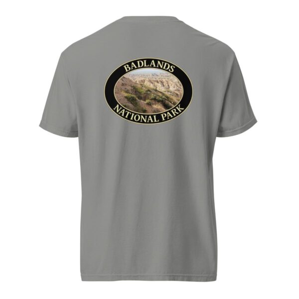 Grey Comfort Colors 1717 heavyweight T-shirt featuring a scenic graphic of Big Horn Sheep at Badlands National Park, framed in an oval design.