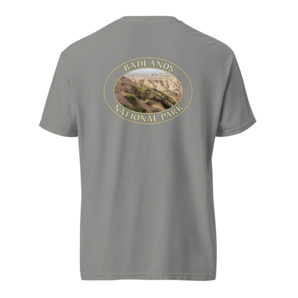 Grey Comfort Colors 1717 heavyweight T-shirt featuring a scenic graphic of Big Horn Sheep at Badlands National Park, framed in an oval design.