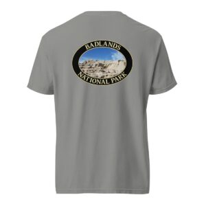 Grey Comfort Colors 1717 heavyweight T-shirt featuring a scenic graphic of Badlands National Park, framed in an oval design.