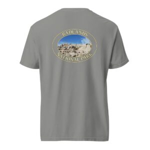 Grey Comfort Colors 1717 heavyweight T-shirt featuring a scenic graphic of Badlands National Park, framed in an oval design.