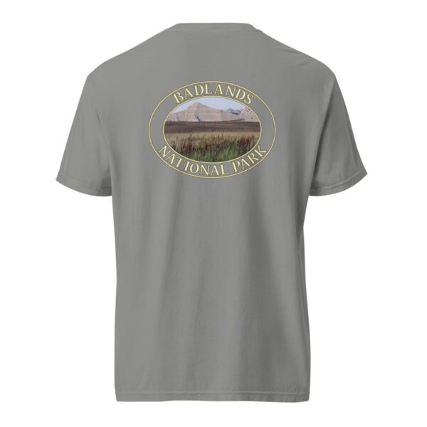 Grey Comfort Colors 1717 heavyweight T-shirt featuring a scenic graphic of reeds at Badlands National Park, framed in an oval design.