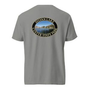 Grey Comfort Colors heavyweight T-shirt featuring a scenic Sylvan Lake design at Custer State Park, framed in an oval border.