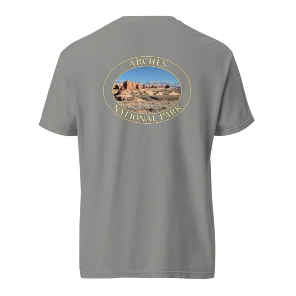 Grey Comfort Colors heavyweight T-shirt featuring a scenic view of The Windows at Arches National Park, framed in an oval border.