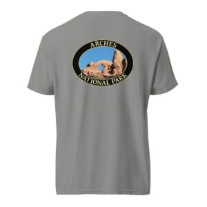 Grey Comfort Colors heavyweight T-shirt featuring a scenic view of Turret Arch at Arches National Park, framed in an oval border.