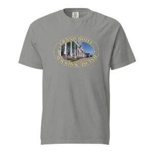 Grey Comfort Colors 1717 heavyweight T-shirt featuring a Grand Hotel graphic on Mackinac Island with iconic white porch and American flags in an oval design.