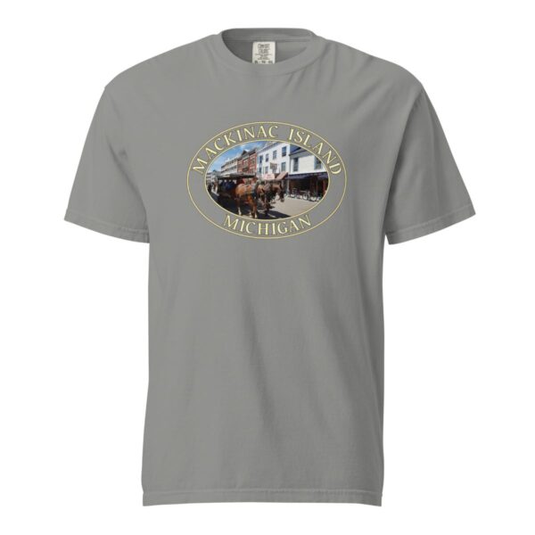 Grey Comfort Colors 1717 heavyweight T-shirt featuring downtown Mackinac Island horse and carriage graphic with historic buildings in an oval design.