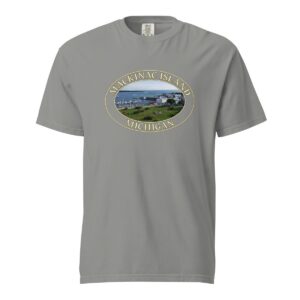 Grey Comfort Colors 1717 heavyweight T-shirt featuring Mackinac Island harbor and downtown graphic with boats and historic buildings in an oval design.