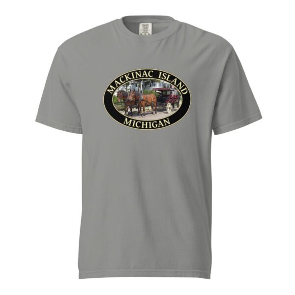 Grey Comfort Colors 1717 heavyweight T-shirt featuring a horse and carriage on the West Bluff of Mackinac Island, with historic Victorian homes and lush greenery in an oval design.