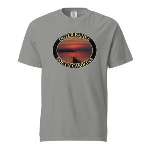 Grey Comfort Colors 1717 heavyweight T-shirt featuring Albemarle Sound sunset graphic on the Outer Banks, with a silhouetted pier and vibrant red sky in an oval design.