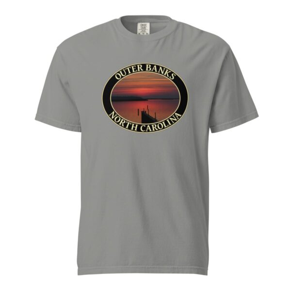 Grey Comfort Colors 1717 heavyweight T-shirt featuring Albemarle Sound sunset graphic on the Outer Banks, with a silhouetted pier and vibrant red sky in an oval design.