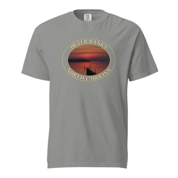 Grey Comfort Colors 1717 heavyweight T-shirt featuring Albemarle Sound sunset graphic on the Outer Banks, with a silhouetted pier and vibrant red sky in an oval design.