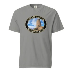 Grey Comfort Colors 1717 heavyweight T-shirt featuring a Watchtower at Grand Canyon National Park graphic in an oval design under a blue sky.