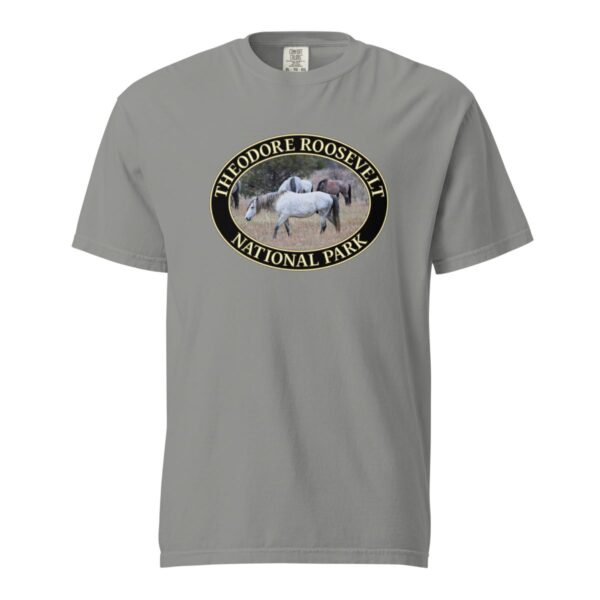 Grey Comfort Colors 1717 heavyweight T-shirt featuring a graphic of wild horses grazing in Theodore Roosevelt National Park’s grasslands, in an oval design.