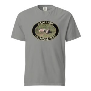 Grey Comfort Colors heavyweight T-shirt featuring a prairie dog couple graphic at Badlands National Park, framed in an oval design.