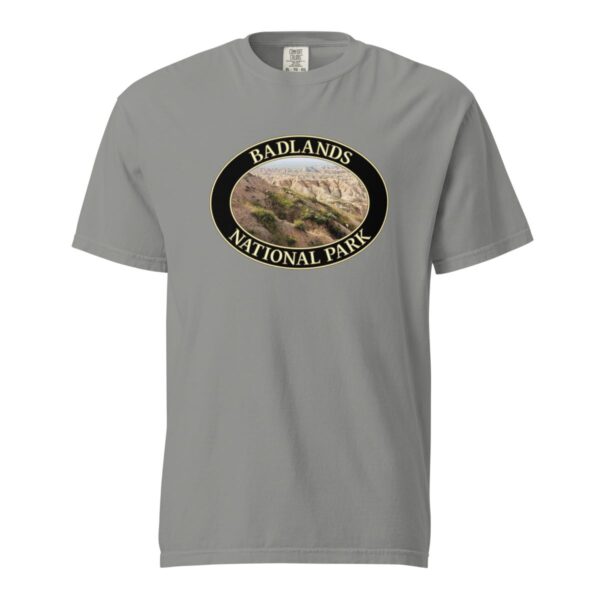 Grey Comfort Colors 1717 heavyweight T-shirt featuring a scenic graphic of Big Horn Sheep at Badlands National Park, framed in an oval design.