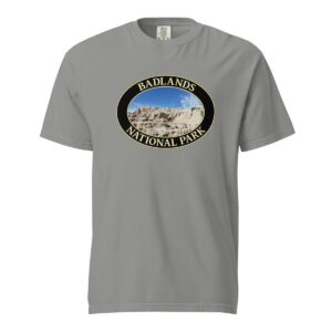 Grey Comfort Colors 1717 heavyweight T-shirt featuring a scenic graphic of Badlands National Park, framed in an oval design.