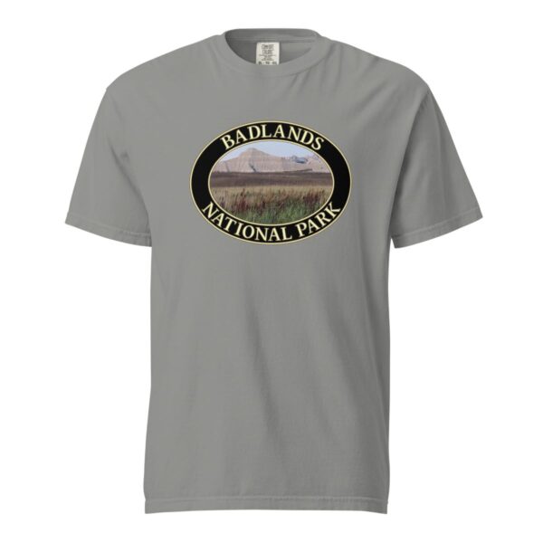 Grey Comfort Colors 1717 heavyweight T-shirt featuring a scenic graphic of reeds at Badlands National Park, framed in an oval design.