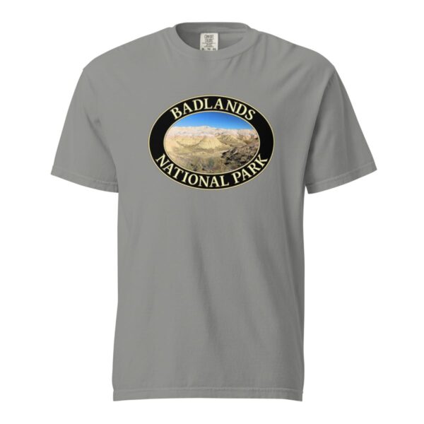 Grey Comfort Colors heavyweight T-shirt featuring a scenic Yellow Mounds design at Badlands National Park, framed in an oval border.