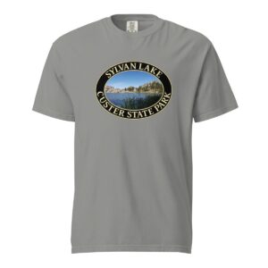 Grey Comfort Colors heavyweight T-shirt featuring a scenic Sylvan Lake design at Custer State Park, framed in an oval border.