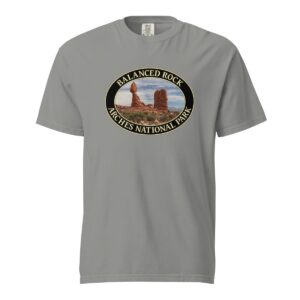 Grey Comfort Colors heavyweight T-shirt featuring the iconic Balanced Rock at Arches National Park, framed in an oval border.