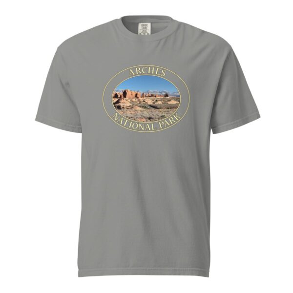 Grey Comfort Colors heavyweight T-shirt featuring a scenic view of The Windows at Arches National Park, framed in an oval border.