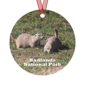 Badlands National Park ornament featuring a prairie dog couple, printed on a 3.5-inch aluminum circle with a red ribbon for hanging