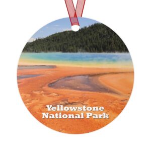 A vibrant ornament featuring the Grand Prismatic Spring at Yellowstone National Park, highlighting its striking orange and blue thermal features. Crafted from durable aluminum, this 3.5-inch ornament includes a glossy finish and red ribbon for hanging.