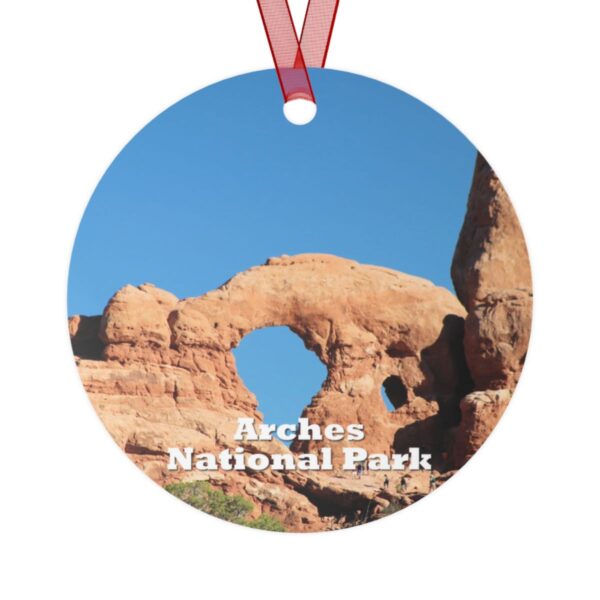 Arches National Park ornament featuring Turret Arch against a vibrant blue sky, 3.5-inch aluminum with red ribbon