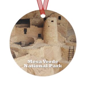 Mesa Verde National Park ornament featuring a closeup of Cliff Palace, printed on a 3.5-inch aluminum circle with a red ribbon for hanging